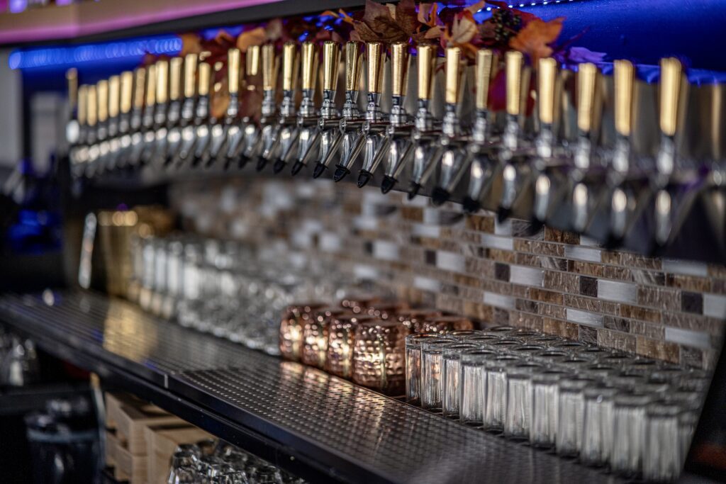 Dozens of beer taps in a row
